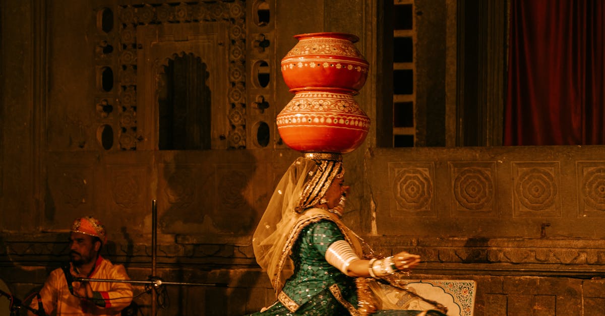 Indian dancer performing traditional dance indoors, showcasing cultural heritage.